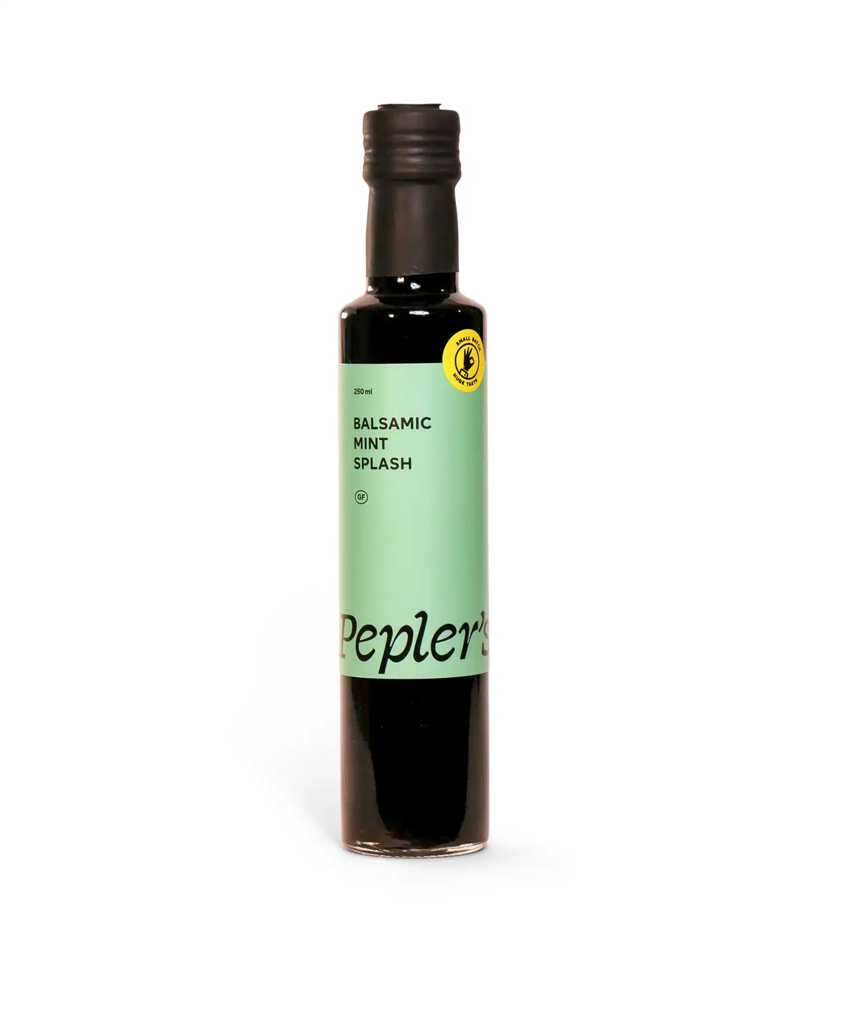 A bottle of balsamic mint splash measuring 250 ml, featuring a black cap and a label with a light green background. The label prominently displays the product name "Balsamic Mint Splash" and the brand "Pepler's," along with a yellow seal indicating gluten-free status. The bottle is set against a white background, emphasising its design and branding.