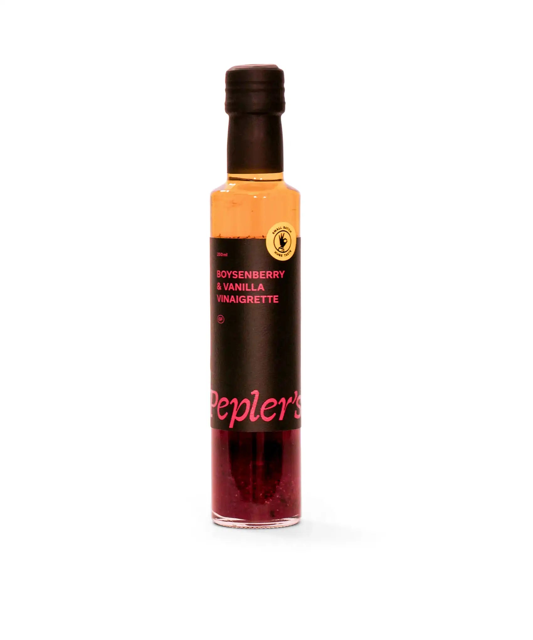 A bottle of Pepler's Boysenberry & Vanilla Vinaigrette, showcasing a dark coloured liquid with a rich hue at the bottom, and a clear upper section. The bottle features a sleek design with a black label prominently displaying the product name and volume (250ml), alongside a small badge indicating it is made from small batch production. The background is plain white, emphasising the vibrant colours of the vinaigrette and the stylish packaging.