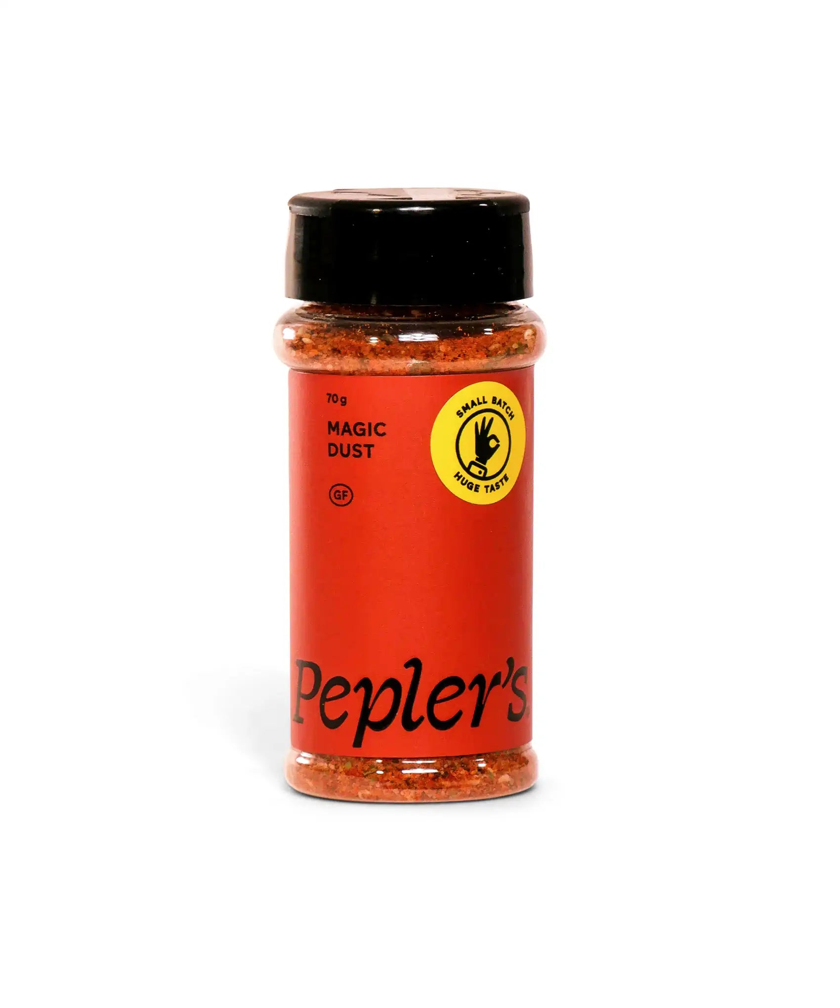 A transparent spice jar filled with a colourful seasoning mix, labeled "Pepler's Magic Dust." The jar features a black lid and red label with bold black text. A bright yellow sticker reads "Small Batch Huge Taste" and indicates the product is gluten-free. The jar contains 70 grams of the spice. The background is plain white, emphasising the product.
