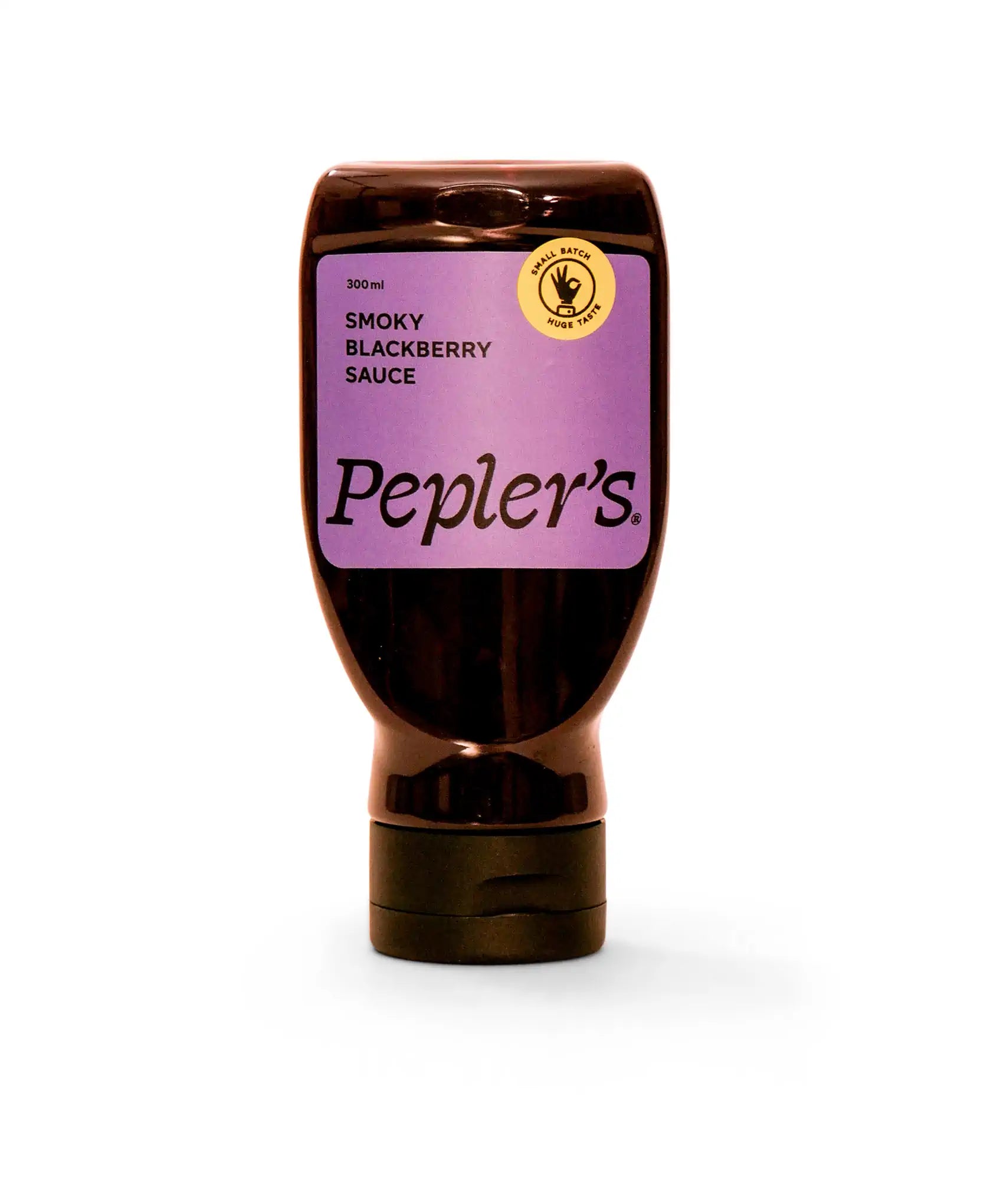 A bottle of Pepler's Smoky BBQ Sauce, labeled prominently in orange on a transparent plastic bottle. The bottle is 300 ml and features a black cap at the bottom, with a circular emblem indicating "Small Batch, Huge Taste." The background is plain white, emphasising the product.